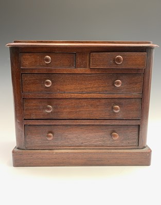 Lot 11 - A Victorian mahogany miniature chest of two...