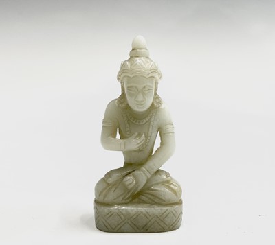 Lot 236 - A Chinese carved white jade miniature figure...