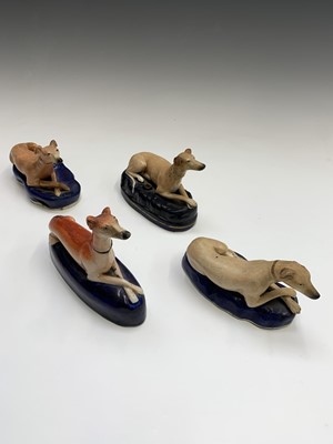 Lot 810 - A Staffordshire pottery greyhound pen holder,...