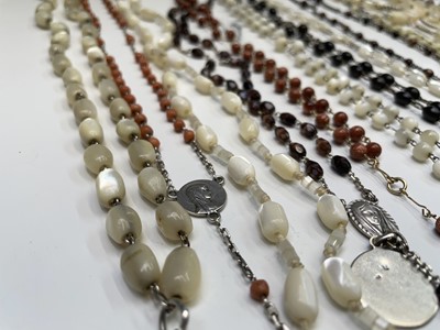 Lot 430 - Fourteen rosary bead necklaces, all with...