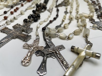 Lot 430 - Fourteen rosary bead necklaces, all with...