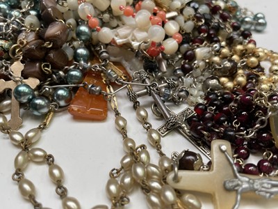 Lot 430 - Fourteen rosary bead necklaces, all with...