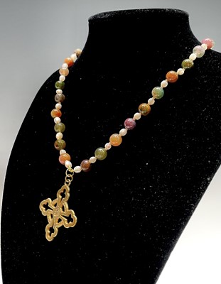 Lot 430 - Fourteen rosary bead necklaces, all with...