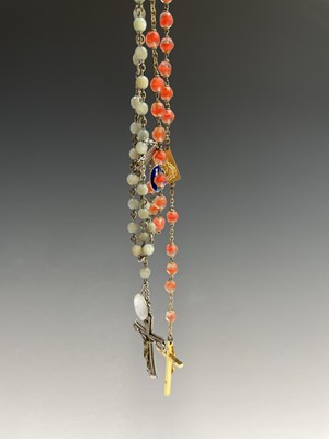 Lot 430 - Fourteen rosary bead necklaces, all with...