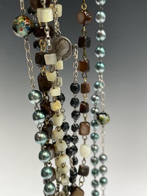 Lot 430 - Fourteen rosary bead necklaces, all with...