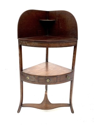 Lot 3006 - A late George III mahogany corner washstand,...