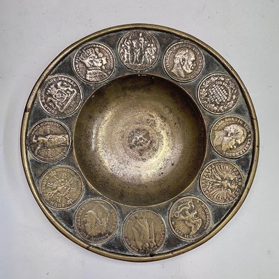 Lot 41 - A bronze dish, the rim inset with replicas of...