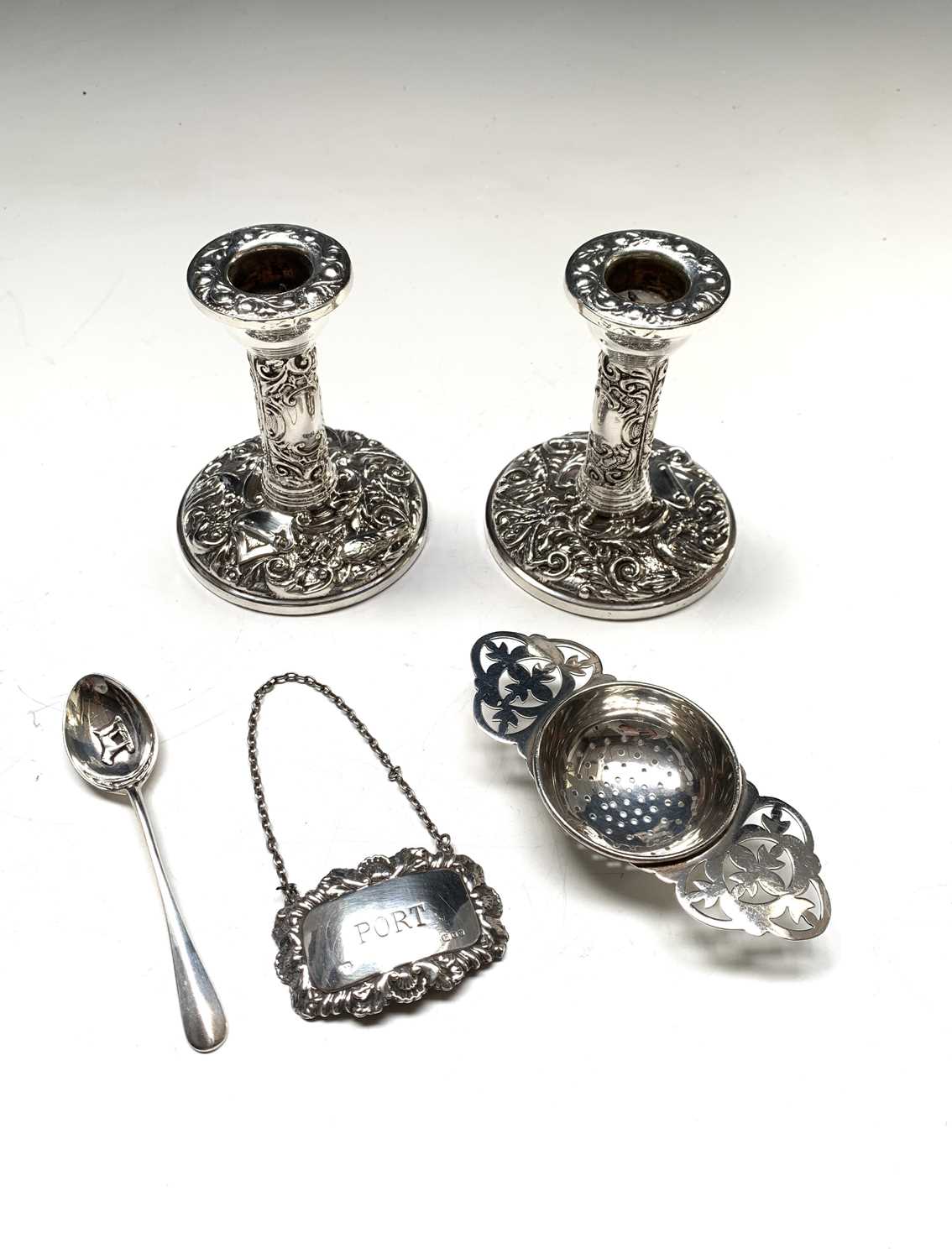 Lot 88 - A pair of low embossed filled silver...