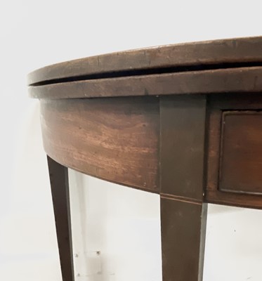 Lot 3085 - A George III mahogany half-round fold-top tea...