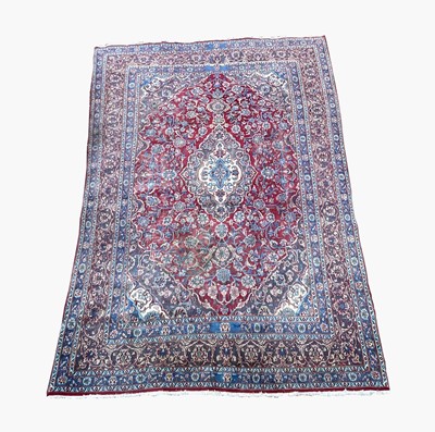 Lot 1228 - A Meshad carpet, South East Persia, the madder...