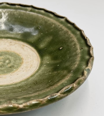 Lot 6 - A Chinese celadon dish, Ming Dynasty, with a...