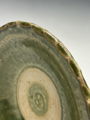 Lot 6 - A Chinese celadon dish, Ming Dynasty, with a...