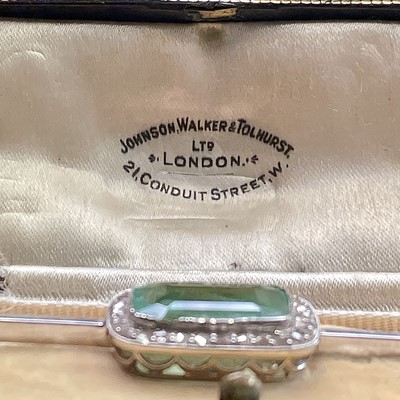 An Art Deco platinum brooch set a 6ct emerald...