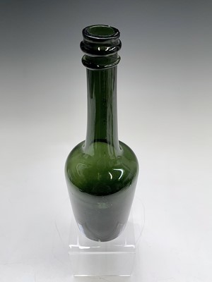 Lot 56 - A late 18th century blown green glass bottle....