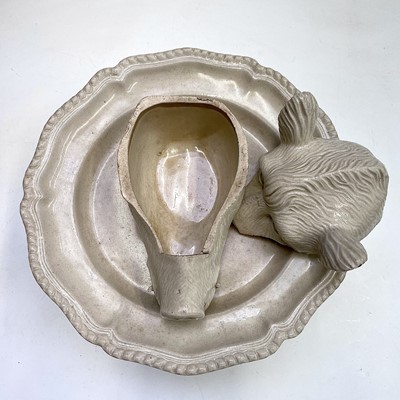 Lot 878 - A porcelain tureen and cover in the form of a...