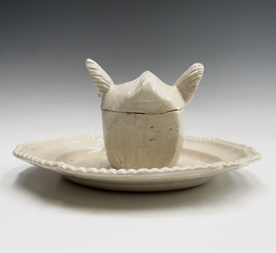 Lot 878 - A porcelain tureen and cover in the form of a...