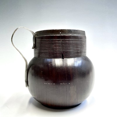 Lot 24 - An early 18th century turned lignum vitae mug,...