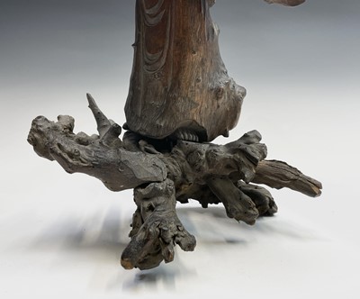 Lot 9 - A Chinese carved rootwood figure of a man in a...