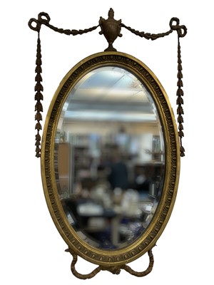 Lot 3010 - An Edwardian gilt gesso oval wall mirror, in...