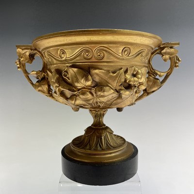 Lot 68 - A gilt bronze twin handled urn, late 19th...