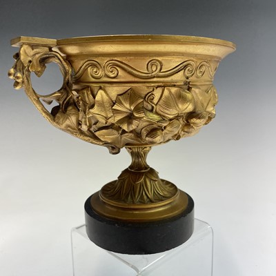 Lot 68 - A gilt bronze twin handled urn, late 19th...