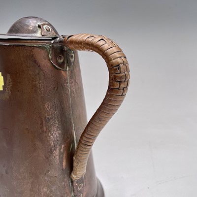 Lot 50 - An Arts and Crafts copper lidded jug, by...