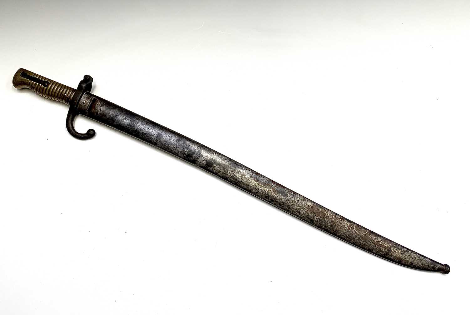 Lot 291 - A French 1874 pattern bayonet, with brass grip,...