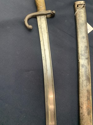 Lot 291 - A French 1874 pattern bayonet, with brass grip,...