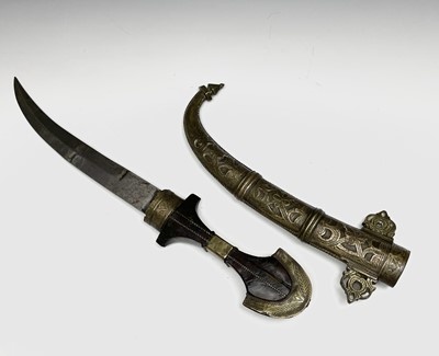 Lot 293 - A Kris, with carved wood grip and bone mounted...