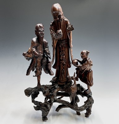 Lot 29 - A Chinese root carving of three figures and a...