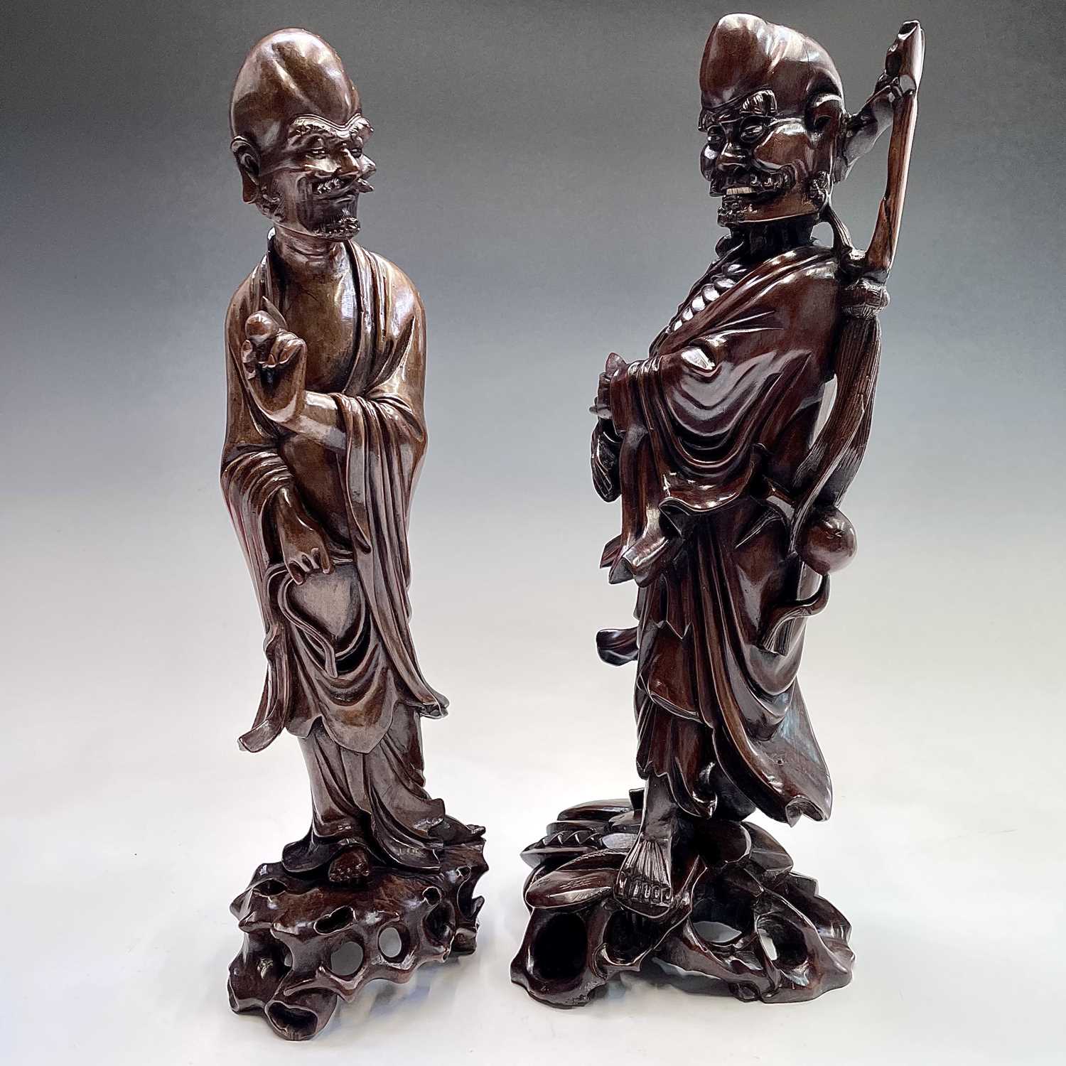 Lot 121 - Two Chinese carved wood figures, 19th century,...