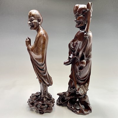 Lot 121 - Two Chinese carved wood figures, 19th century,...