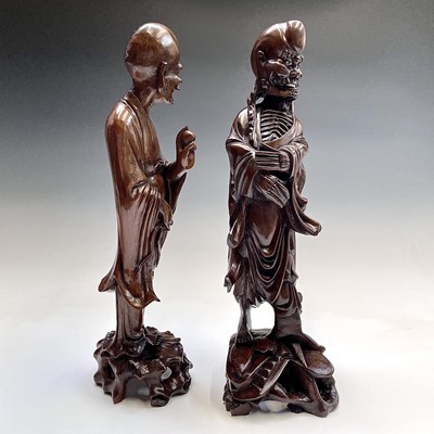 Lot 121 - Two Chinese carved wood figures, 19th century,...