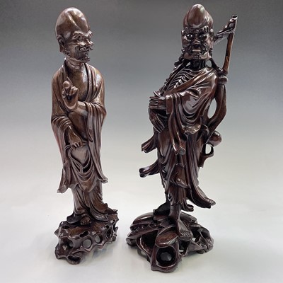 Lot 121 - Two Chinese carved wood figures, 19th century,...