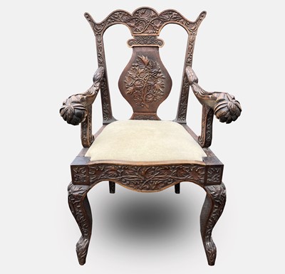 Lot 1026 - An Anglo-Indian carved hardwood armchair, late...