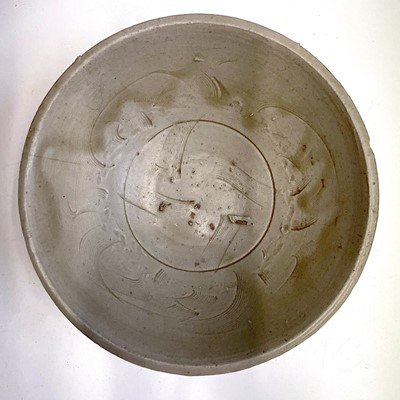 Lot 82 - A Northern Song Ding ware bowl, with combed...