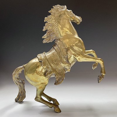 Lot 79 - A pair of brass rearing horse ornaments in the...