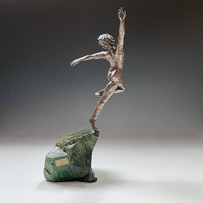 Lot 83 - A bronzed figure of a dancing male, on green...
