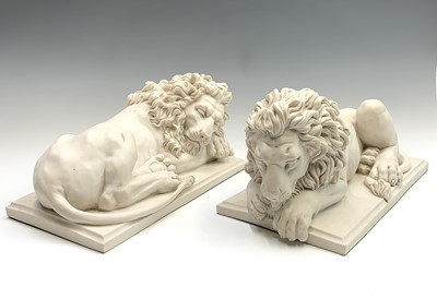 Lot 386 - After Canova, A pair of resin lions on moulded...