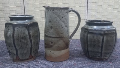 Lot 85 - Two similar octagonal studio pottery vases, 18....