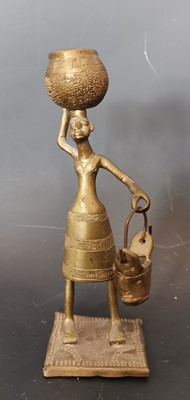 Lot 92 - An African brass figurine.   Height: 16cm.