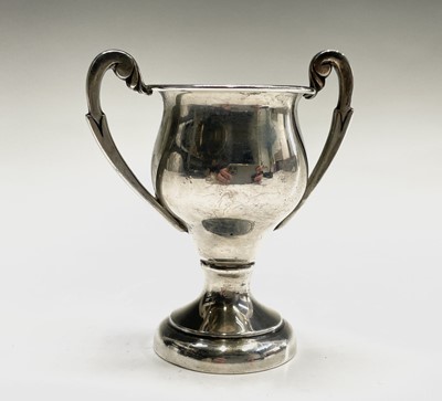 Lot 143 - A small hallmarked silver twin handled trophy,...