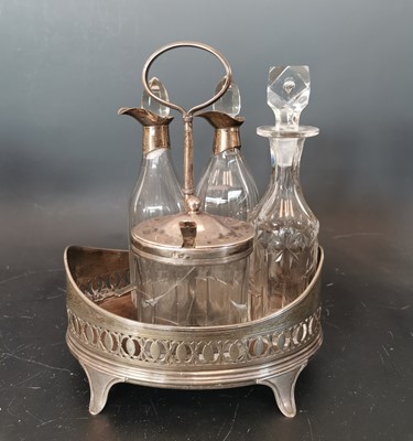Lot 7 - A George III silver cruet stand with various...
