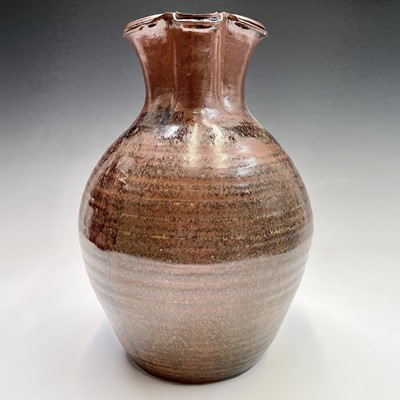 Lot 920 - A large studio pottery brown glazed jug,...