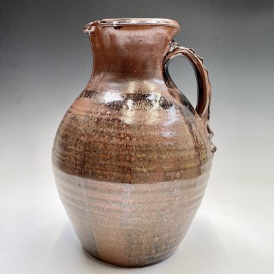 Lot 920 - A large studio pottery brown glazed jug,...