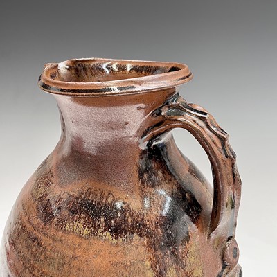 Lot 920 - A large studio pottery brown glazed jug,...