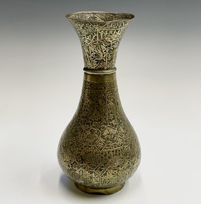 Lot 1013 - A Persian brass baluster vase, late 19th...