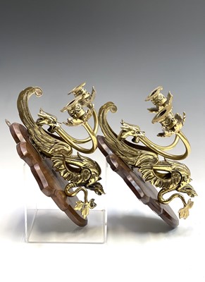Lot 135 - A pair of Victorian brass dragon candle...