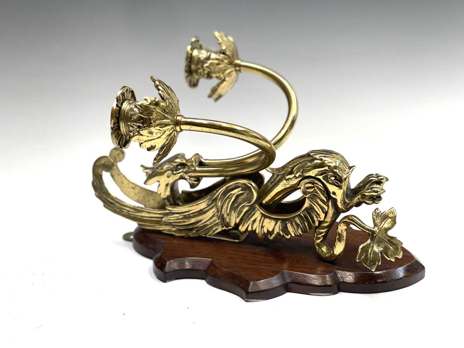 Lot 135 - A pair of Victorian brass dragon candle