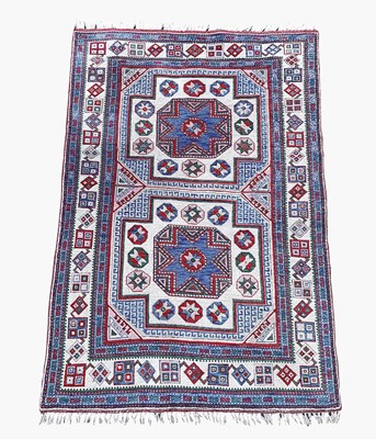 Lot 1208 - A Turkish rug, mid-late 20th century, with two...